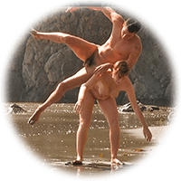 acrobatic nude couple playing on the beach