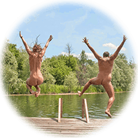 couple leaps off the end of the dock into the water