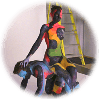 fully painted couple gets photographed against a white backdrop